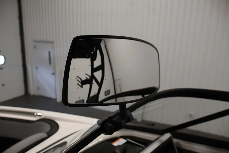 Slide: The Image of Side mirror of 2026 Yamaha Boats 255XE in a showroom setting. - 48