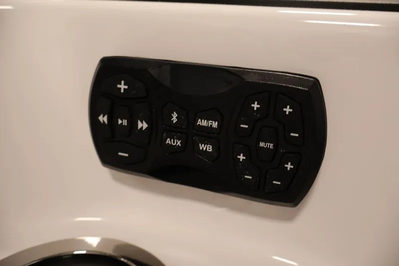 Slide: The Image of Audio control panel on 2026 Yamaha Boats 255XE, featuring various function buttons. - 12