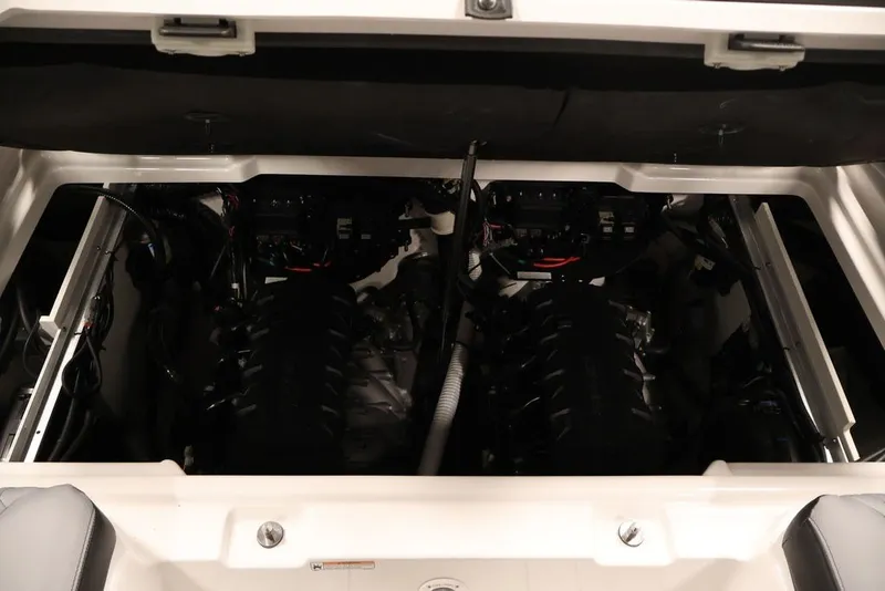 Slide: The Image of Engine compartment of 2026 Yamaha Boats 255XE, showcasing dual engines and mechanical components. - 55