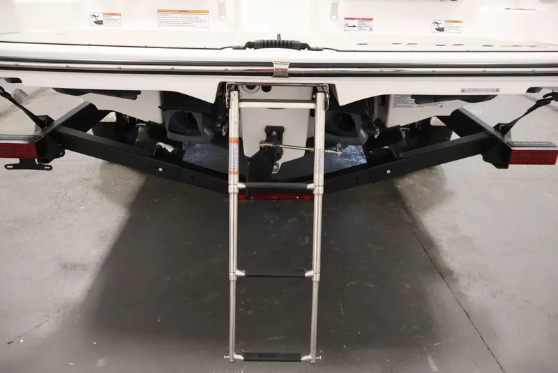 Slide: The Image of Rear view of 2026 Yamaha Boats 255XE with extended swim ladder. - 18