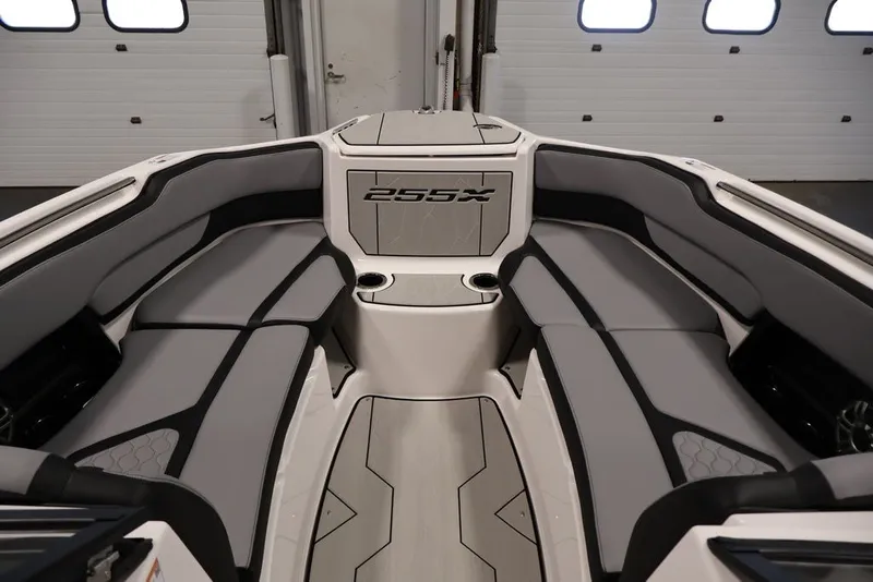 Slide: The Image of Interior of 2026 Yamaha Boats 255XE, featuring sleek gray seating and modern design. - 35