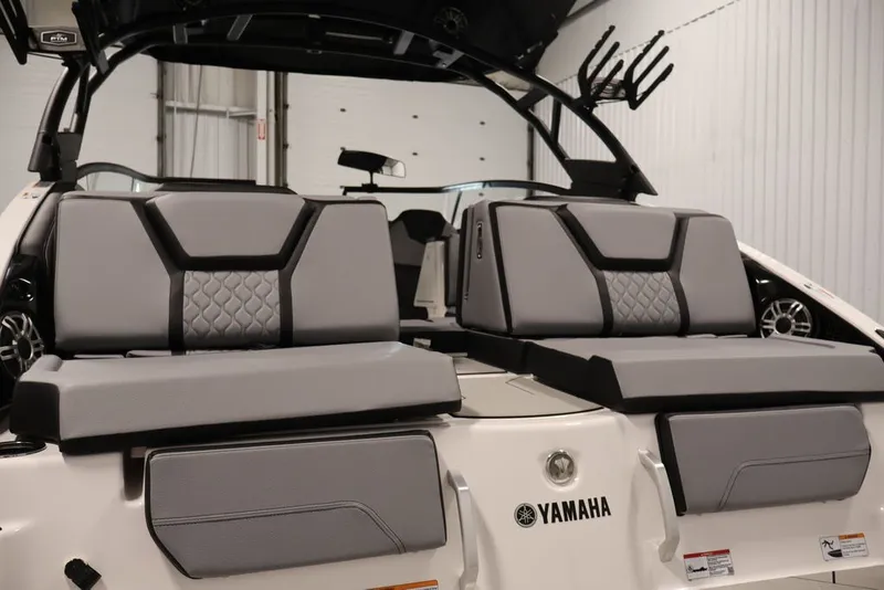 Slide: The Image of 2026 Yamaha Boats 255XE interior with sleek gray seating and modern design. - 3