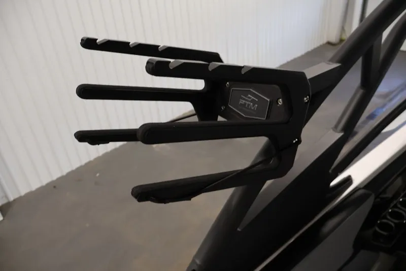 Slide: The Image of Wakeboard rack on 2026 Yamaha Boats 255XE, featuring sleek black design and PTM branding. - 26