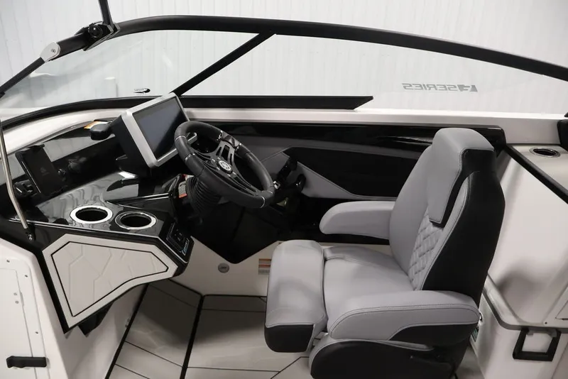 Slide: The Image of 2026 Yamaha Boats 255XE cockpit with modern steering and touchscreen display. - 50