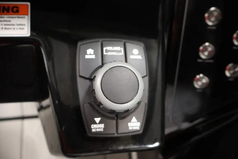Slide: The Image of Control panel of 2026 Yamaha Boats 255XE featuring cruise and volume settings. - 22