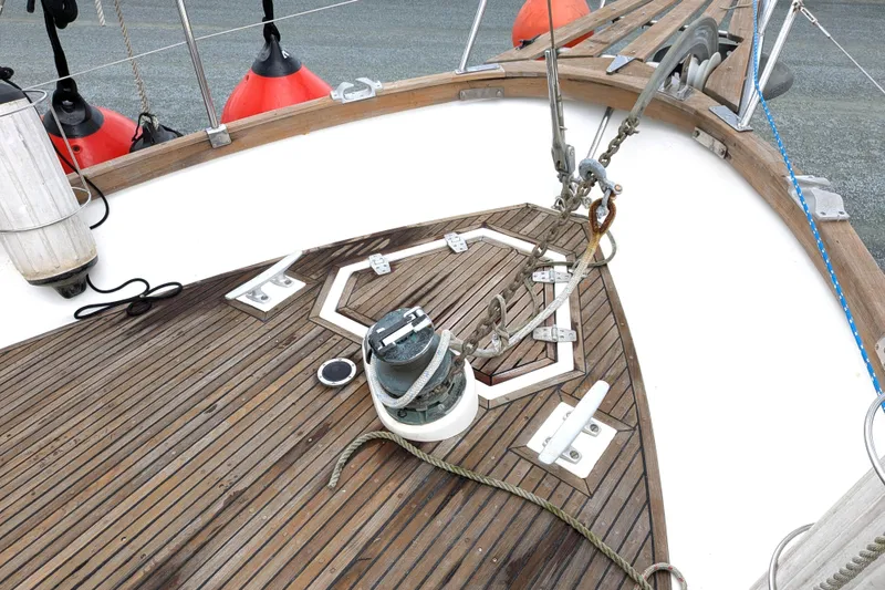 Slide: The Image of Deck of 1985 Siltala Nauticat 44 sailboat with wooden finish and anchor chain. - 11