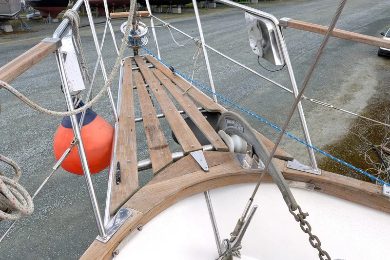 Slide: The Image of 1985 Siltala Nauticat 44 sailboat deck with anchor and orange buoy. - 12