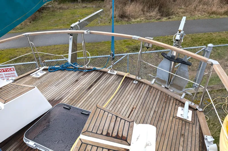 Slide: The Image of Deck of 1985 Siltala Nauticat 44 sailboat with wooden flooring and anchor. - 20