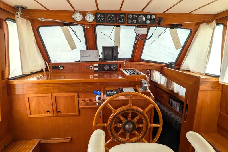 Slide: The Image of Interior of 1985 Siltala Nauticat 44 yacht with wooden helm and navigation instruments. - 29