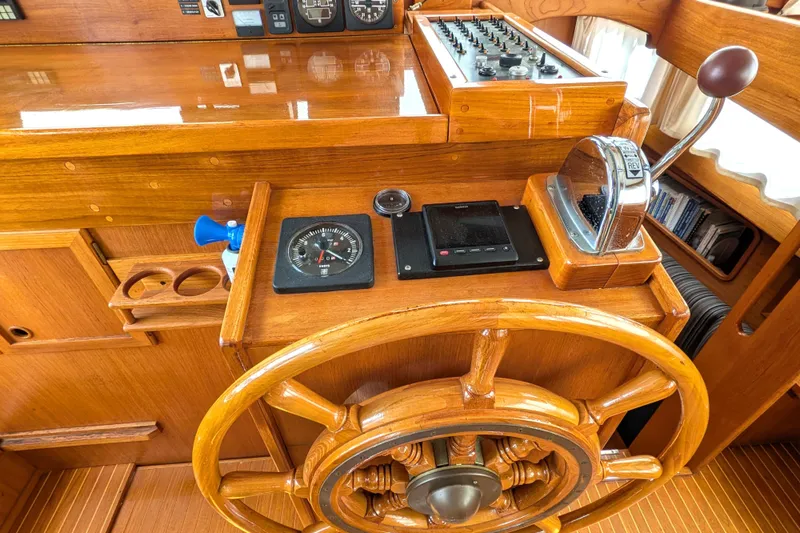Slide: The Image of Wooden helm station of 1985 Siltala Nauticat 44 with compass and throttle controls. - 30