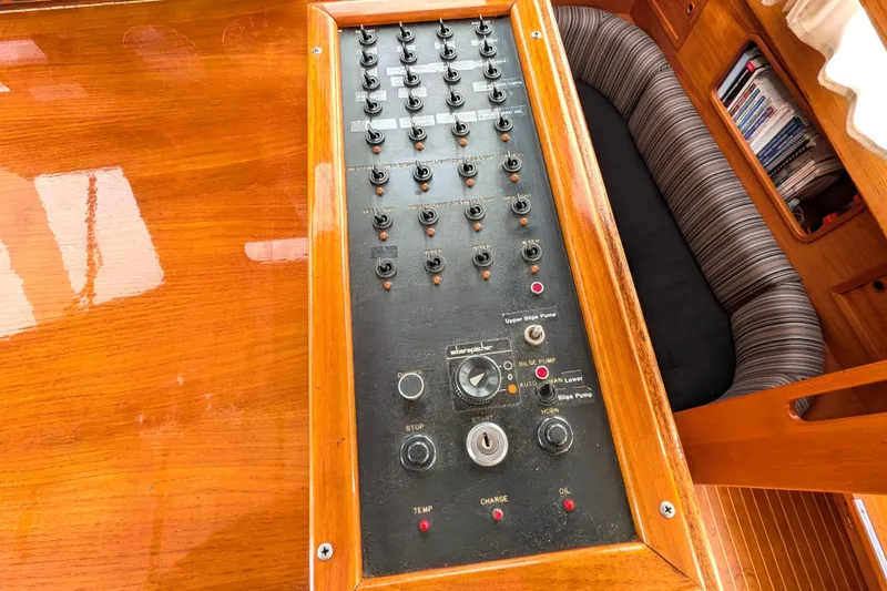 Slide: The Image of Control panel on 1985 Siltala Nauticat 44 yacht, featuring switches and dials. - 31