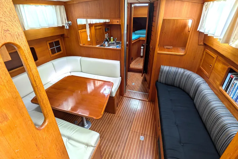 Slide: The Image of Interior of 1985 Siltala Nauticat 44 yacht with wooden furnishings and cozy seating. - 35