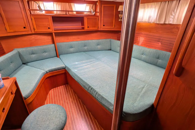 Slide: The Image of Interior of 1985 Siltala Nauticat 44 yacht with cozy seating and wooden finish. - 56