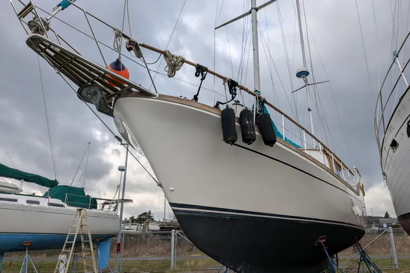 Slide: The Image of 1985 Siltala Nauticat 44 sailboat on dry dock, cloudy sky background. - 6