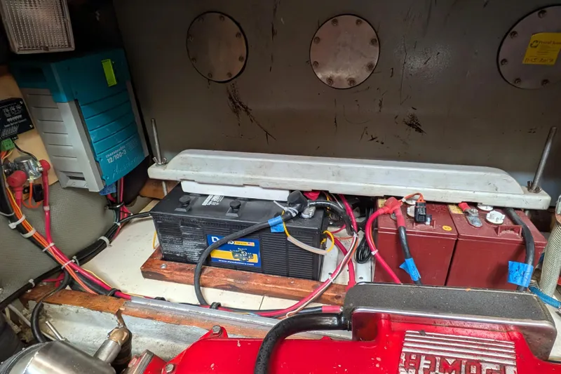 Slide: The Image of Battery compartment of a 1985 Siltala Nauticat 44, featuring wiring and electrical components. - 67
