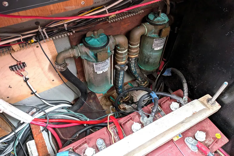 Slide: The Image of Engine room of a 1985 Siltala Nauticat 44 with wiring and filters visible. - 69