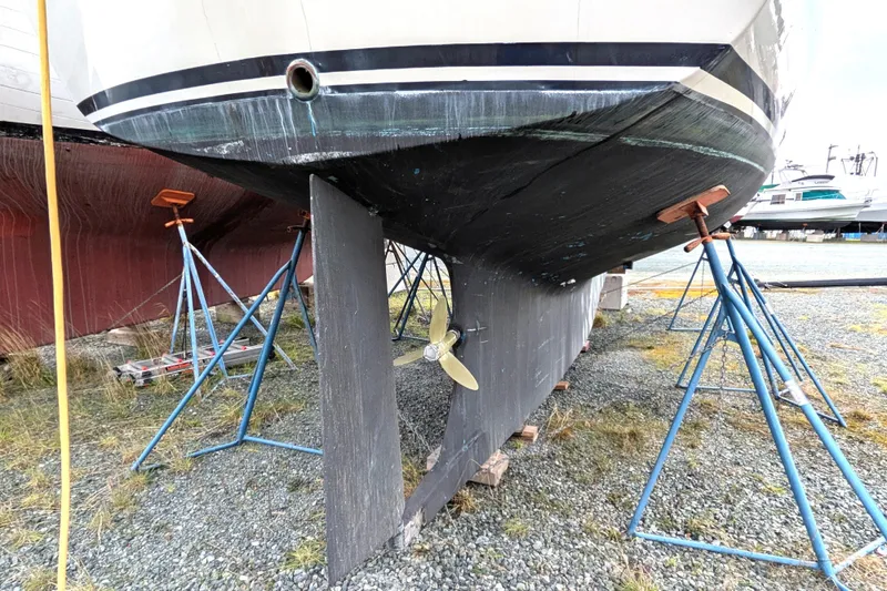 Slide: The Image of 1985 Siltala Nauticat 44 sailboat on stands, showing hull and propeller. - 7