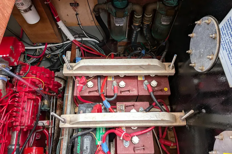 Slide: The Image of Engine room of 1985 Siltala Nauticat 44 with batteries and wiring. - 74