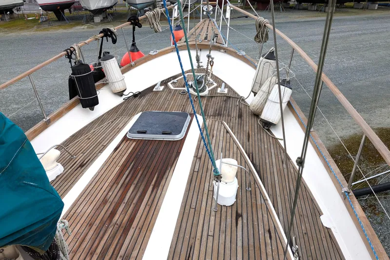 Slide: The Image of 1985 Siltala Nauticat 44 sailboat deck with wooden finish and nautical equipment. - 9