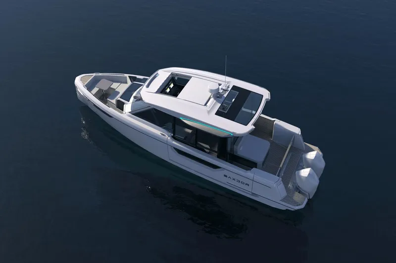 Slide: The Image of The image shows a modern Saxdor 400 GTC boat on calm water with a sleek design. - 16