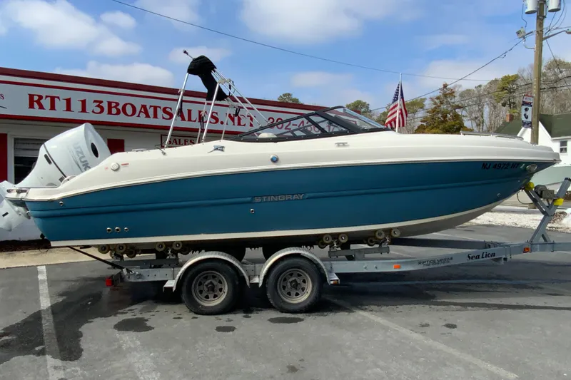 The Image of 2023 Stingray 231 DC boat on trailer at RT113 Boat Sales. - 1