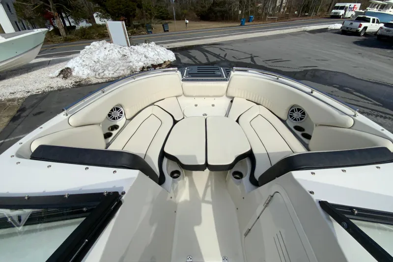Slide: The Image of 2023 Stingray 231 DC boat interior with spacious seating and modern design. - 17