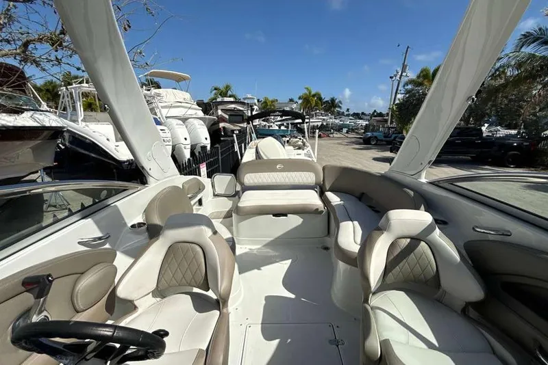 Slide: The Image of 2021 Crownline 255 XSS boat interior with luxurious seating and modern design. - 10