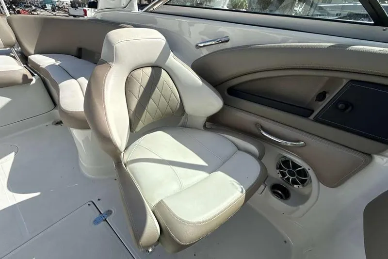 Slide: The Image of 2021 Crownline 255 XSS boat interior with beige seating and modern design. - 29