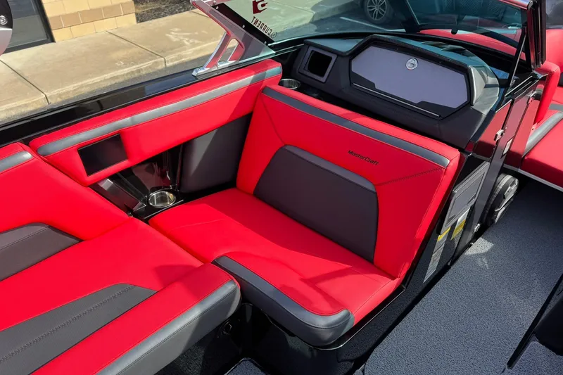 Slide: The Image of 2020 MasterCraft XStar boat interior with red and black seating, modern design. - 18