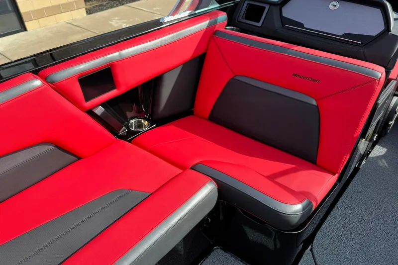 Slide: The Image of Red and black interior seating of 2020 MasterCraft XStar boat. - 24