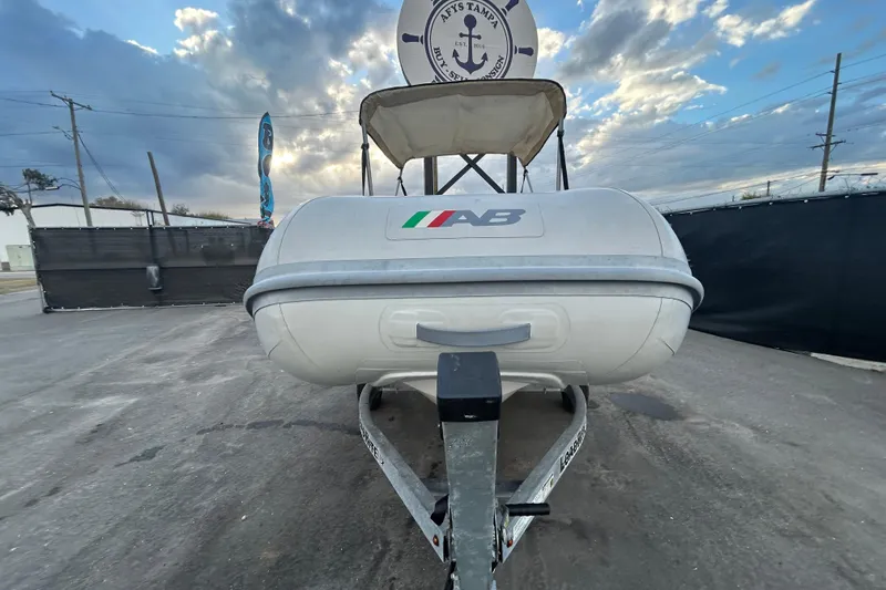 Slide: The Image of 2021 AB Inflatables Mares 10 VSX boat on trailer under cloudy sky. - 10