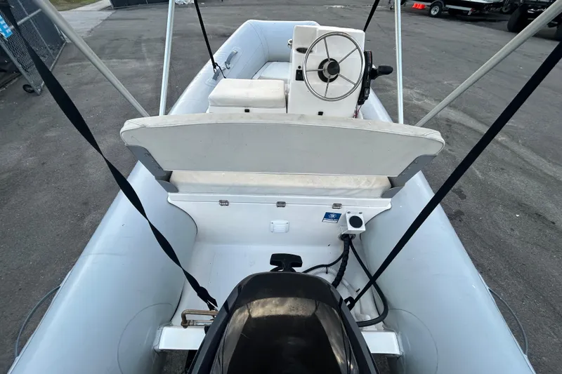 Slide: The Image of 2021 AB Inflatables Mares 10 VSX boat interior with steering console and seating. - 12