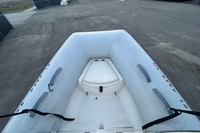 Slide: The Image of 2021 AB Inflatables Mares 10 VSX boat, top view, on a concrete surface. - 16