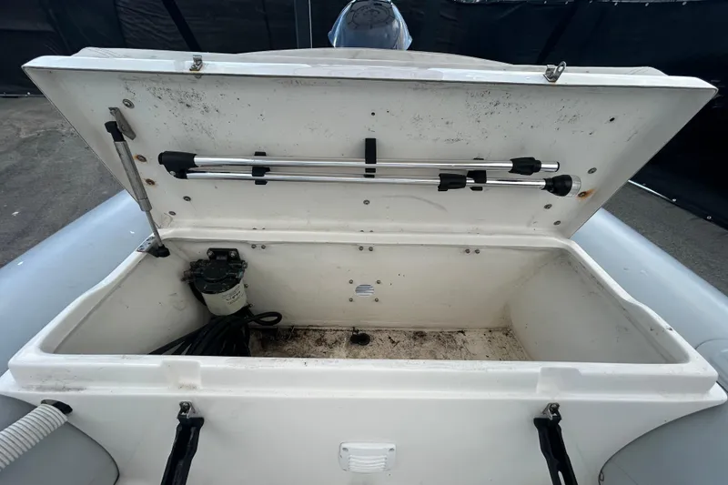 Slide: The Image of Open storage compartment of 2021 AB Inflatables Mares 10 VSX boat, showing interior details. - 24