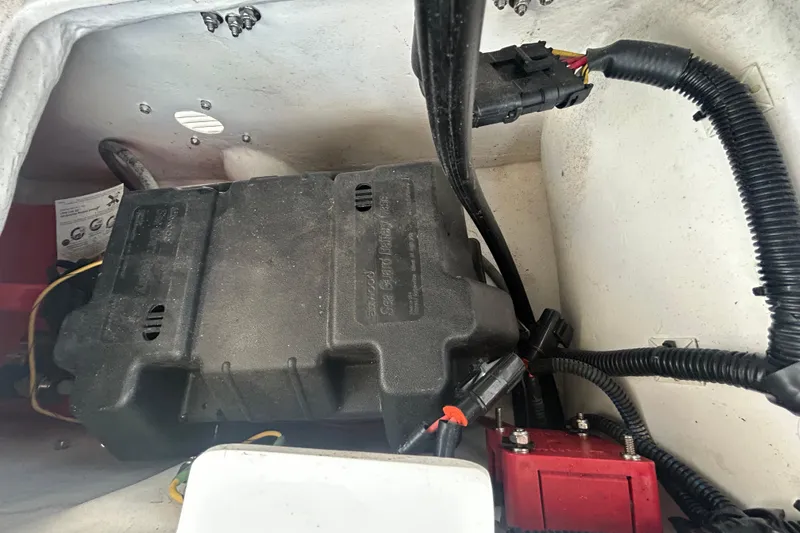 Slide: The Image of 2021 AB Inflatables Mares 10 VSX battery compartment with wiring and connections. - 27