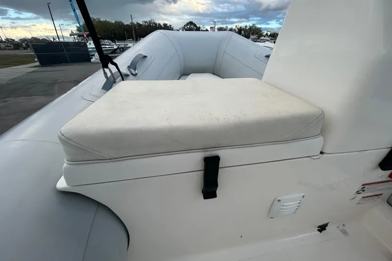 Slide: The Image of 2021 AB Inflatables Mares 10 VSX boat seat with white cushion and strap. - 29