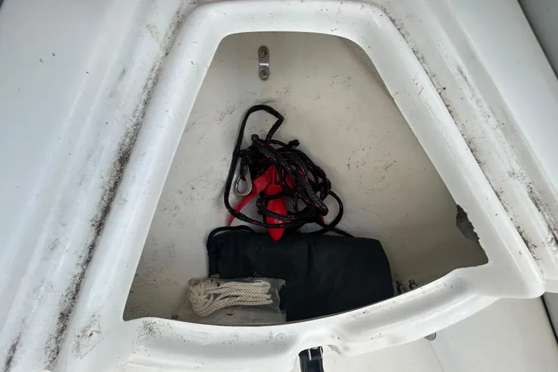 Slide: The Image of Storage compartment of 2021 AB Inflatables Mares 10 VSX with ropes and gear. - 34