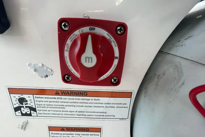 Slide: The Image of 2021 AB Inflatables Mares 10 VSX battery switch with carbon monoxide warning labels. - 35