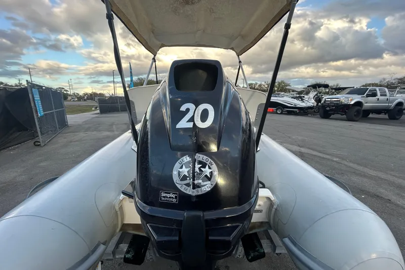 Slide: The Image of 2021 AB Inflatables Mares 10 VSX boat with outboard motor, parked outdoors. - 4