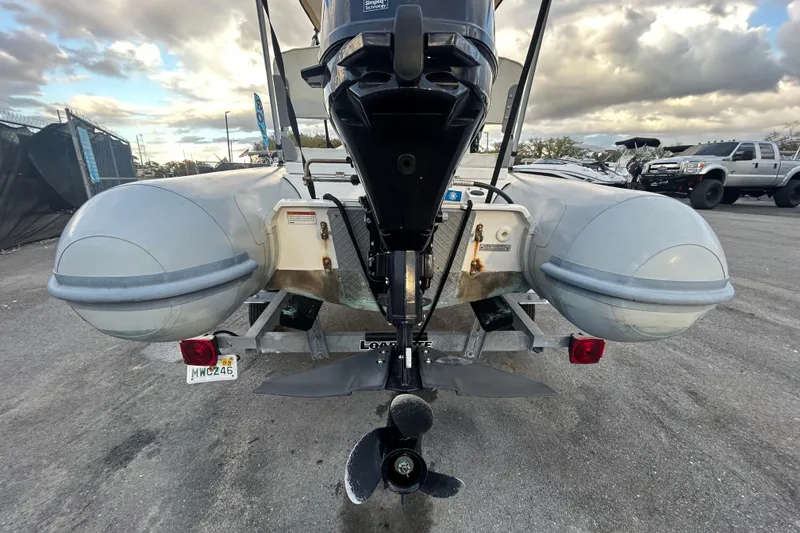 Slide: The Image of Rear view of 2021 AB Inflatables Mares 10 VSX boat on trailer, cloudy sky background. - 5