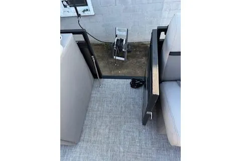 Slide: The Image of 2023 Angler Quest 8522 All Sport boat interior with seating and flooring details. - 12