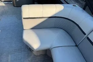 Slide: The Image of 2023 Angler Quest 8522 All Sport boat with cushioned seating area. - 16