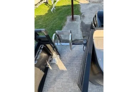 Slide: The Image of 2023 Angler Quest 8522 All Sport boat deck with ladder and seating area. - 27