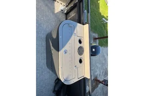 Slide: The Image of 2023 Angler Quest 8522 All Sport boat interior with motor and seating area. - 28