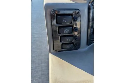 Slide: The Image of Control panel of 2023 Angler Quest 8522 All Sport boat with switches. - 31