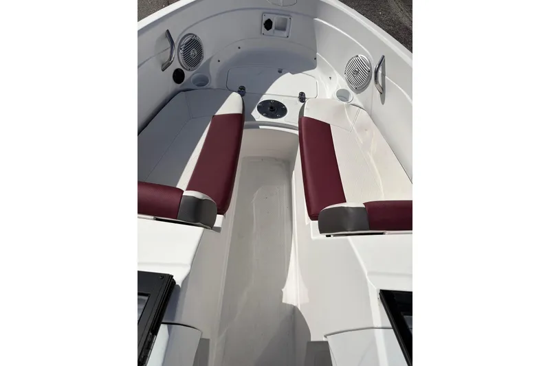Slide: The Image of 2023 Tahoe 200 S boat interior with maroon seats and white deck. - 3
