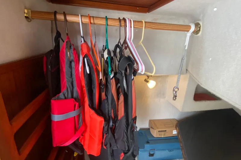 Slide: The Image of Life jackets hanging in a Ranger Tugs R-29 boat cabin, 2010 model. - 13