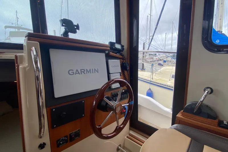 Slide: The Image of Interior helm of 2010 Ranger Tugs R-29 with Garmin navigation system. - 19