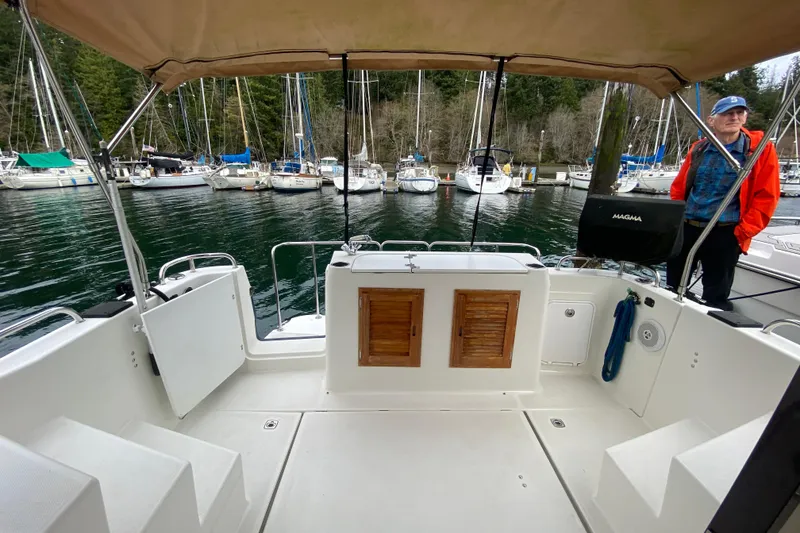 Slide: The Image of 2010 Ranger Tugs R-29 boat interior at marina with sailboats in background. - 30