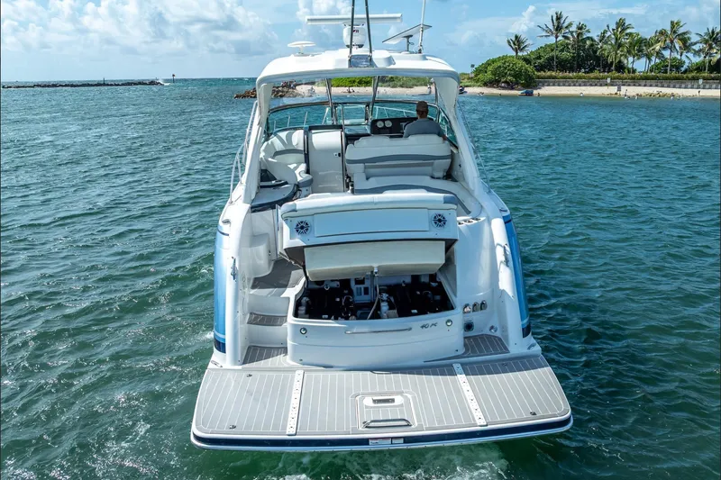 Slide: The Image of 2022 Formula 40 Performance Cruiser on water, rear view, open engine compartment. - 12